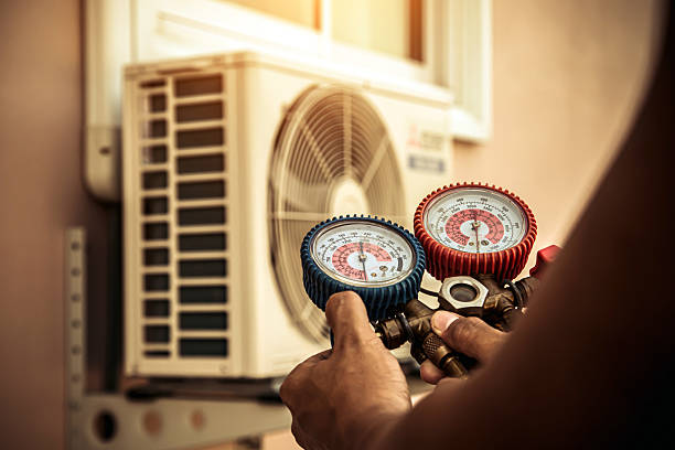 Professional Ductwork Repair technician working in Still River, MA
